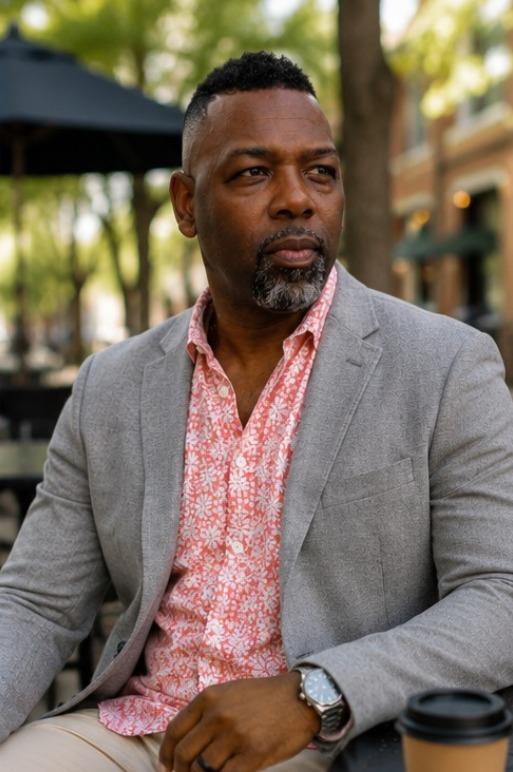 Andre Sims seated outdoors